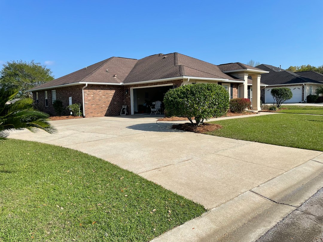 Restoring homeowners property to like new condition using house washing and surface cleaning in Northwest Pensacola.